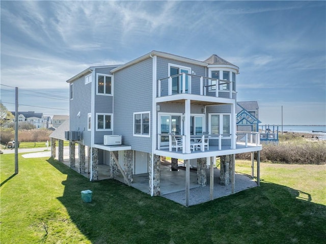 53 Stanton Ave, Narragansett, RI 02882 - back of house featuring a lawn, a balcony, and a patio