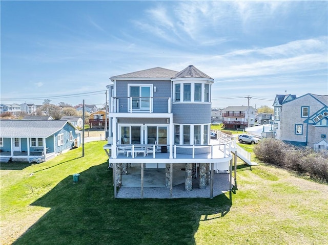 53 Stanton Ave, Narragansett, RI 02882 - back of property with a lawn, a deck, a residential view, a balcony, and a patio