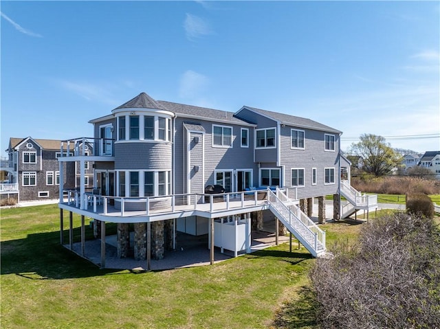 53 Stanton Ave, Narragansett, RI 02882 - back of house with a lawn, a wooden deck, and stairs