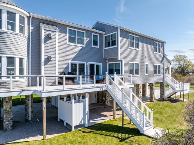 53 Stanton Ave, Narragansett, RI 02882 - back of house featuring a lawn, stairs, a carport, and a deck