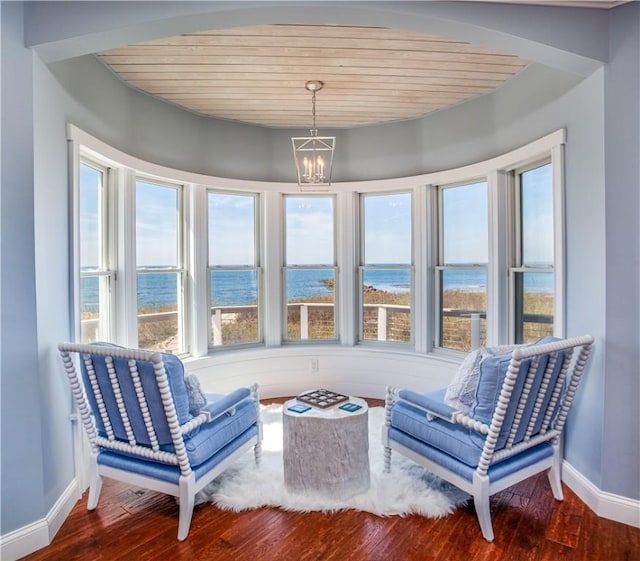 53 Stanton Ave, Narragansett, RI 02882 - living area with wood ceiling, plenty of natural light, a water view, and wood finished floors