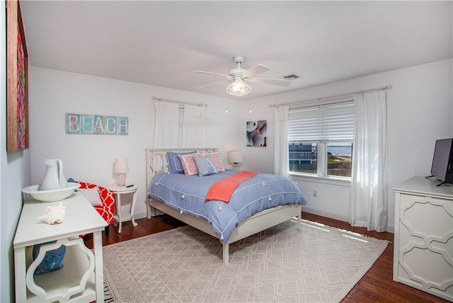 53 Stanton Ave, Narragansett, RI 02882 - bedroom with visible vents, baseboards, ceiling fan, and wood finished floors
