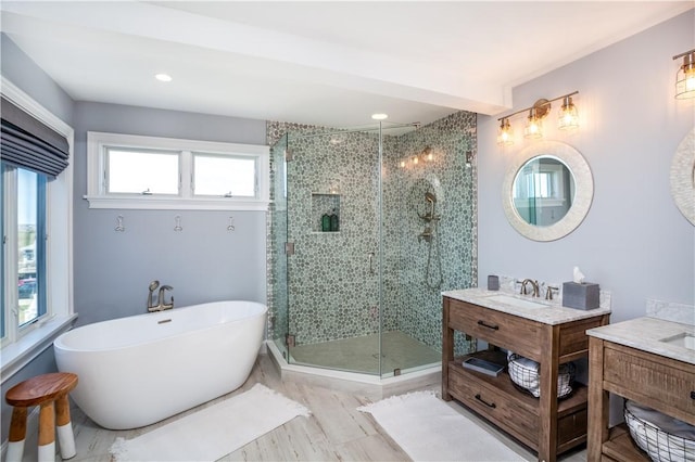 53 Stanton Ave, Narragansett, RI 02882 - bathroom with a sink, recessed lighting, two vanities, a soaking tub, and a stall shower