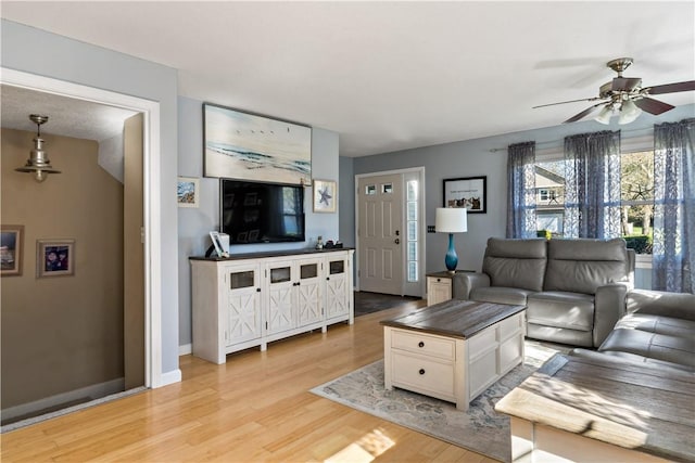 86 Quannacut Rd Unit A, Westerly, RI 02891 - living room with a ceiling fan, light wood-style floors, and baseboards