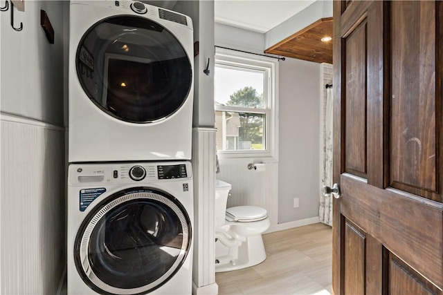 86 Quannacut Rd Unit A, Westerly, RI 02891 - laundry area featuring estacked washer and dryer and baseboards