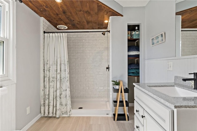 86 Quannacut Rd Unit A, Westerly, RI 02891 - bathroom with a stall shower, vanity, wainscoting, and baseboards