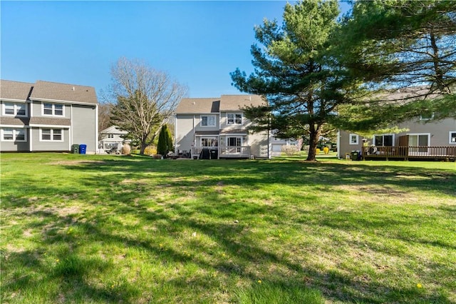 86 Quannacut Rd Unit A, Westerly, RI 02891 - view of grassy yard with a wooden deck