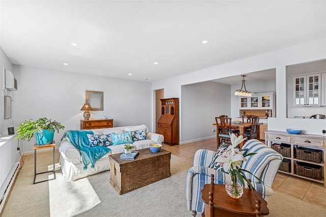 221 Hope St Unit 7, Bristol, RI 02809 - living area featuring light colored carpet, baseboard heating, an AC wall unit, recessed lighting, and baseboards