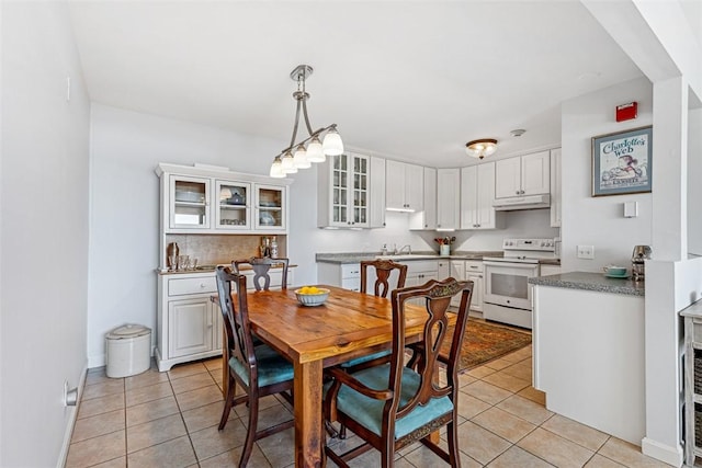 221 Hope St Unit 7, Bristol, RI 02809 - dining space featuring baseboards and light tile patterned floors