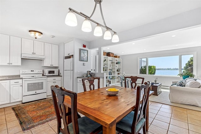 221 Hope St Unit 7, Bristol, RI 02809 - dining space with light tile patterned floors and recessed lighting
