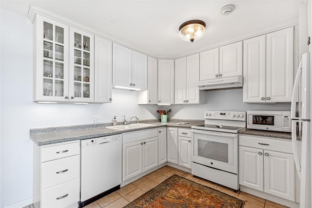 221 Hope St Unit 7, Bristol, RI 02809 - kitchen featuring a sink, light tile patterned floors, under cabinet range hood, white appliances, and white cabinetry