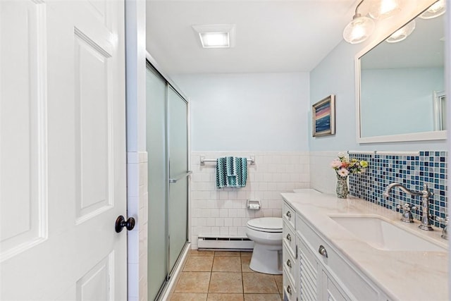 221 Hope St Unit 7, Bristol, RI 02809 - full bath with baseboard heating, vanity, tile patterned floors, tile walls, and a stall shower