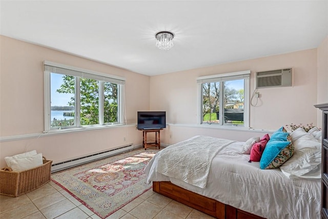 221 Hope St Unit 7, Bristol, RI 02809 - bedroom with light tile patterned floors, baseboard heating, and a wall mounted air conditioner