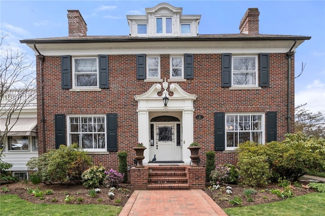 25 Seaview Ave, Cranston, RI 02905 - view of front of property with a chimney and brick siding