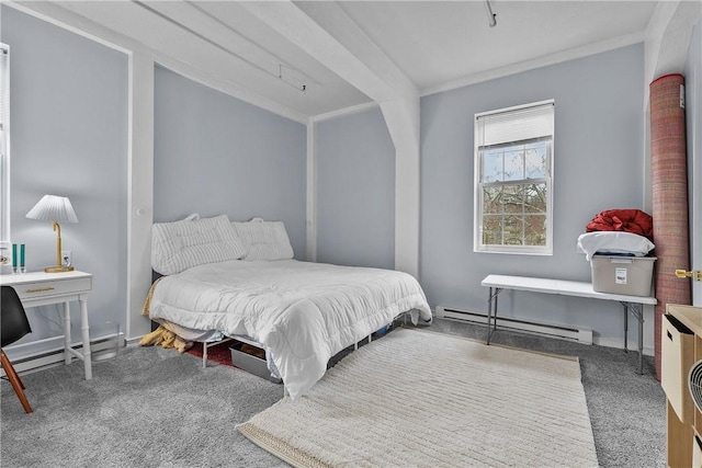 bedroom with baseboards, carpet, and a baseboard heating unit
