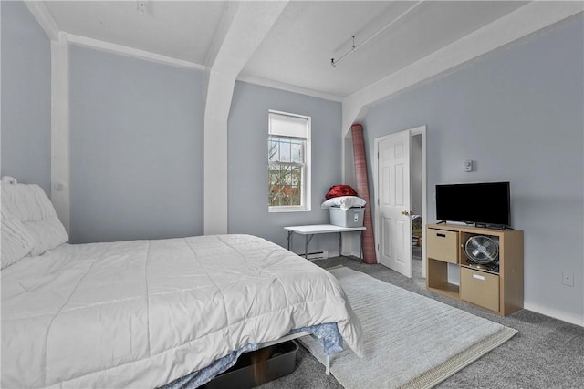 bedroom with a baseboard radiator, baseboards, ornamental molding, and carpet