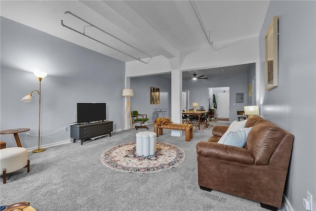 carpeted living room with a ceiling fan and baseboards