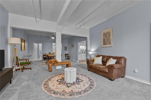 living room with carpet floors and baseboards