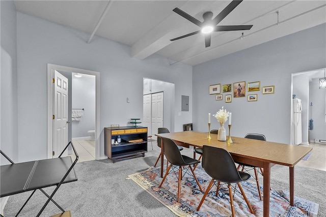 dining room with ceiling fan, light carpet, beam ceiling, and electric panel