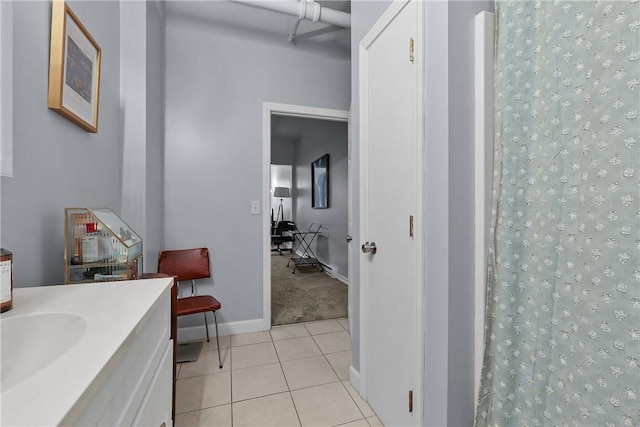 full bath with tile patterned floors, baseboards, vanity, and a shower with shower curtain