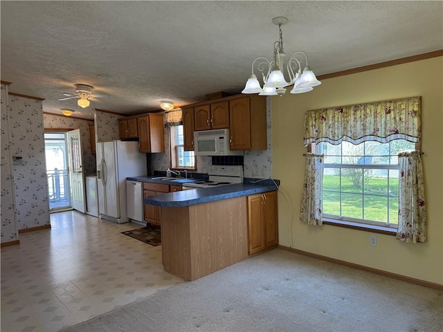11 Cardinal Ct, Tiverton, RI 02878 - kitchen featuring a peninsula, dark countertops, white appliances, and a textured ceiling