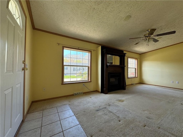 11 Cardinal Ct, Tiverton, RI 02878 - unfurnished living room featuring visible vents, ornamental molding, a wealth of natural light, and carpet