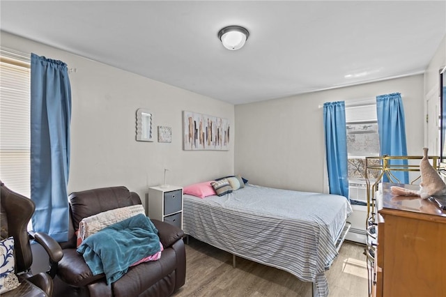 bedroom with wood finished floors