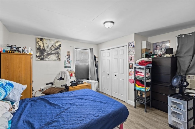 bedroom featuring a closet and light wood-type flooring