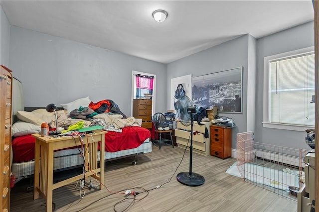 bedroom featuring wood finished floors