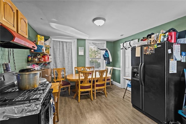 dining space with light wood-style flooring