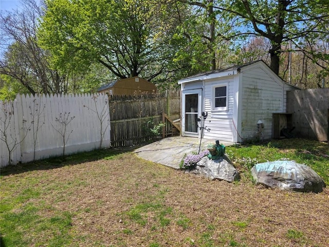 view of outbuilding with an outbuilding and a fenced backyard