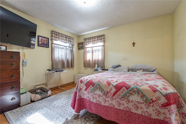 bedroom with wood finished floors