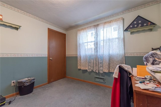 office area featuring baseboards and carpet