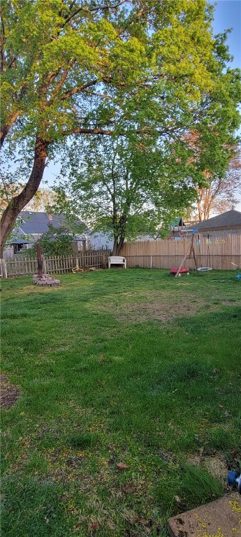 view of yard with a fenced backyard