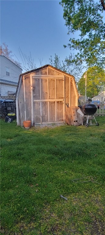 view of shed with fence