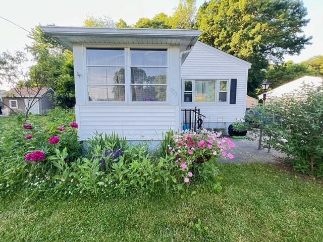 view of side of home with a patio area