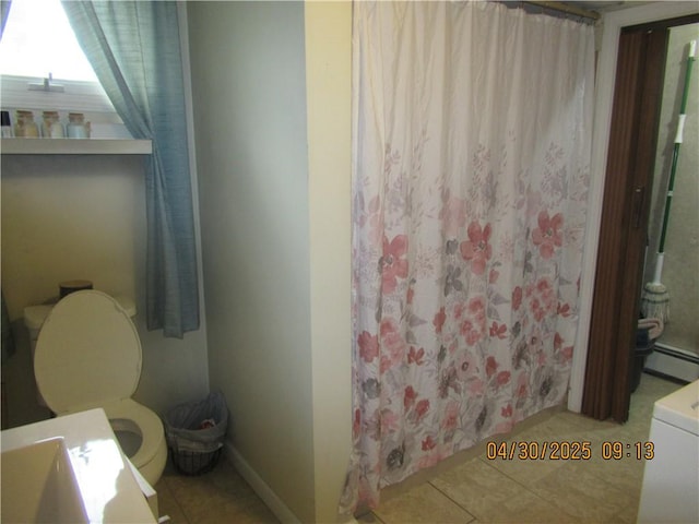 full bath featuring toilet, tile patterned floors, curtained shower, and a baseboard radiator