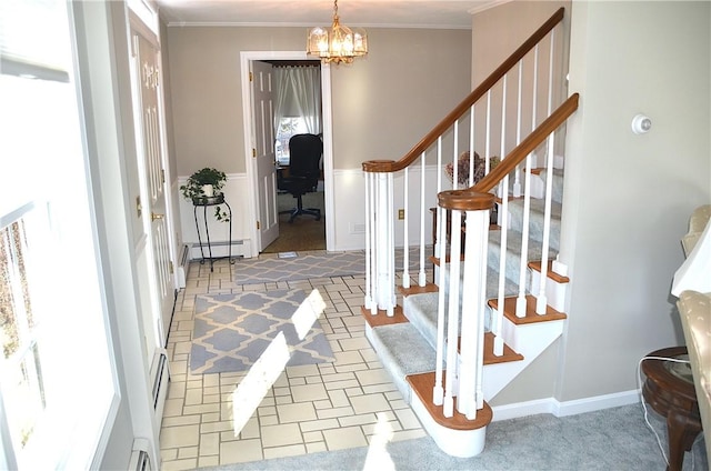 foyer entrance featuring crown molding, a notable chandelier, stairs, and a baseboard radiator