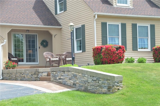 410 Wandsworth St, Narragansett, RI 02882 - doorway to property with a shingled roof and a lawn