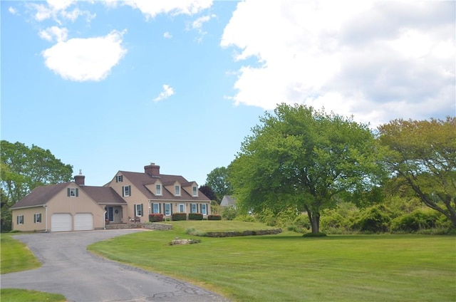 410 Wandsworth St, Narragansett, RI 02882 - cape cod house with a front yard, an attached garage, a chimney, and driveway
