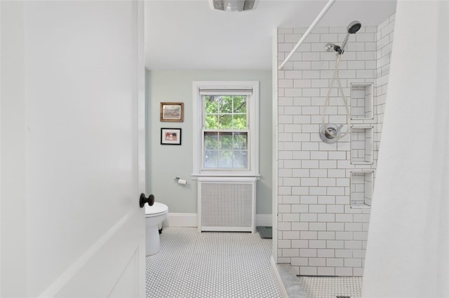 bathroom with tile patterned flooring, visible vents, toilet, radiator heating unit, and tiled shower