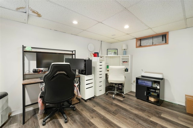office space featuring recessed lighting, wood finished floors, and a paneled ceiling