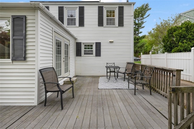 wooden deck featuring french doors