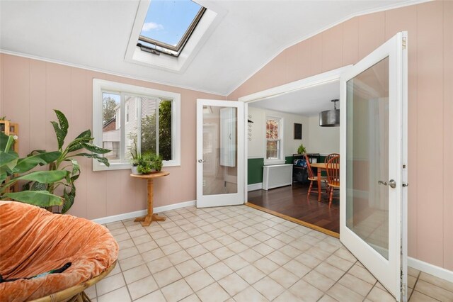 interior space with a skylight and french doors