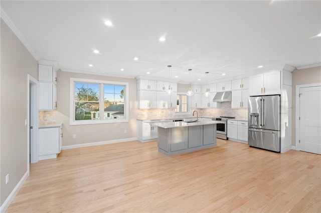 25 Scallop Shell Rd, Narragansett, RI 02882 - kitchen featuring crown molding, light countertops, under cabinet range hood, a sink, and stainless steel appliances
