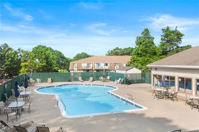 752 Quaker Ln Unit B108, Warwick, RI 02818 - pool with a patio and fence