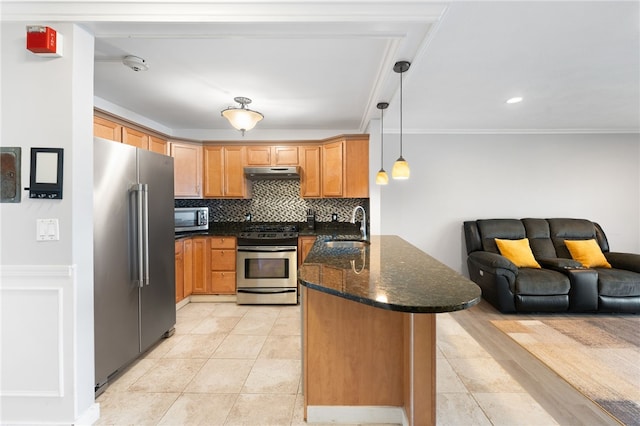 752 Quaker Ln Unit B108, Warwick, RI 02818 - kitchen with a sink, stainless steel appliances, open floor plan, a peninsula, and under cabinet range hood