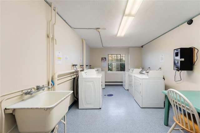 752 Quaker Ln Unit B108, Warwick, RI 02818 - community laundry room featuring light floors, washer and clothes dryer, a sink, and baseboard heating