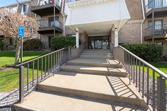 752 Quaker Ln Unit B108, Warwick, RI 02818 - entrance to property featuring brick siding and a lawn