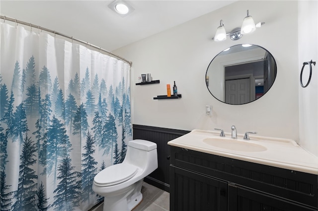 752 Quaker Ln Unit B108, Warwick, RI 02818 - full bathroom featuring vanity, tile patterned flooring, wainscoting, curtained shower, and toilet